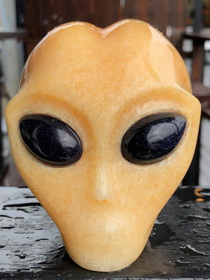 Orange Calcite Alien with Purple Goldstone Eyes [1k1009]